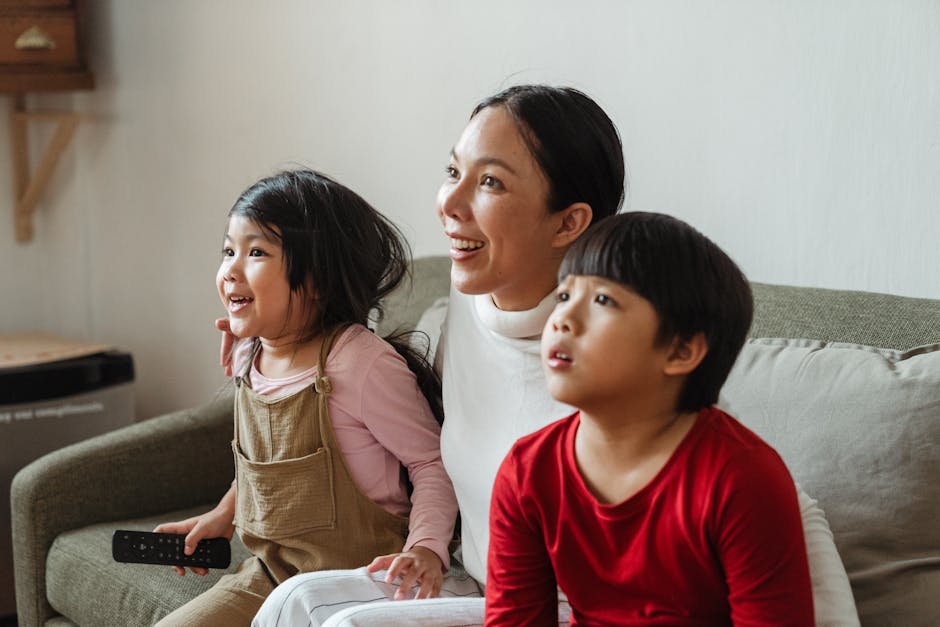 Family enjoying high-quality IPTV streaming on large screen TV with sports and entertainment content
